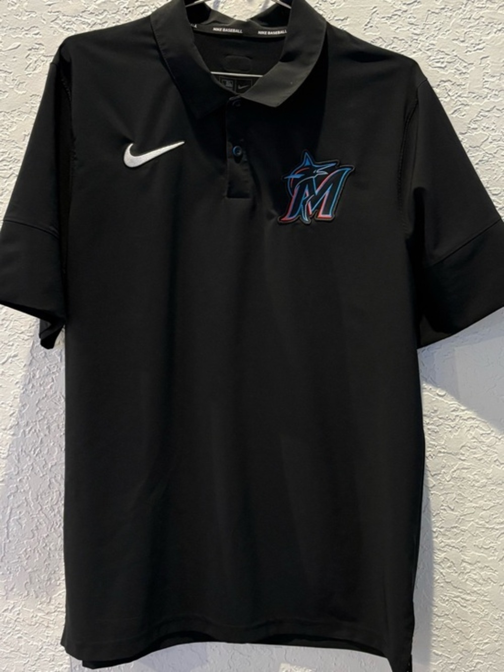 Nike Black Miami Marlins Polo with White Swoosh and Teal Accent